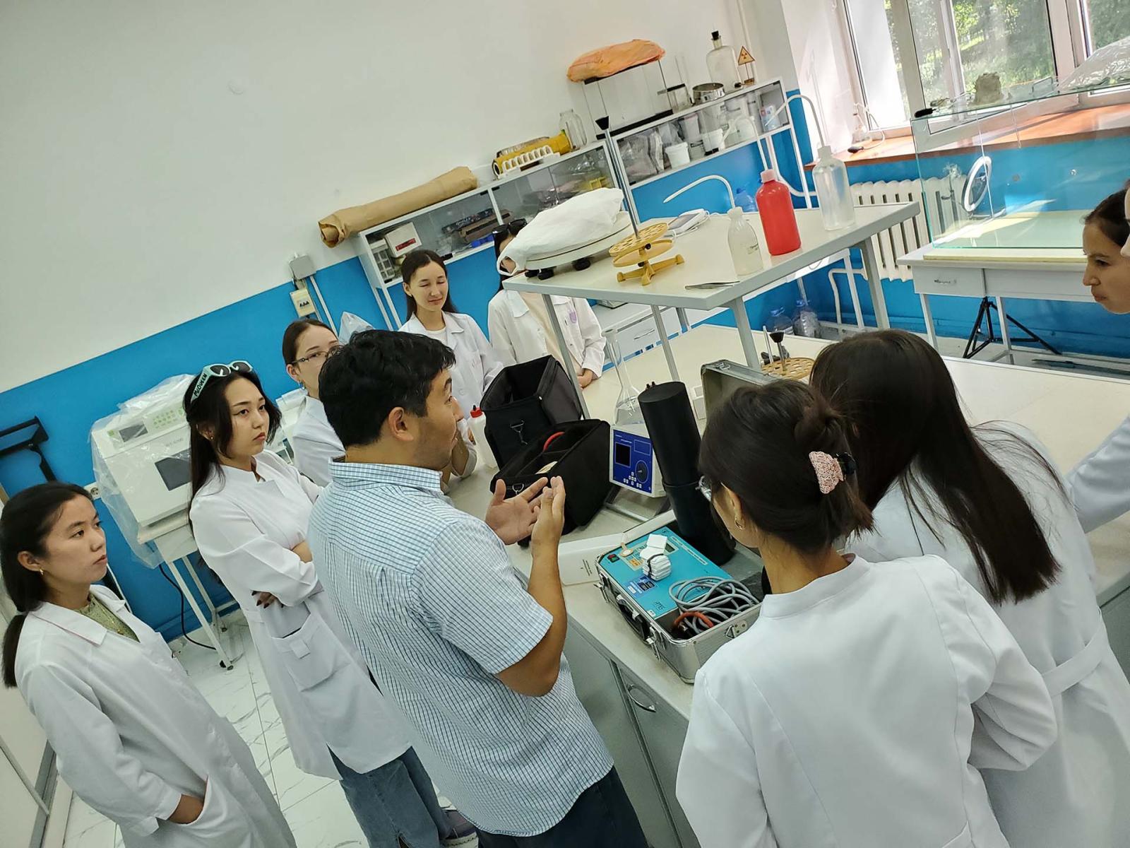 Person talking to group in laboratory